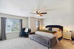 Huge carpeted primary bedroom with great natural light.
