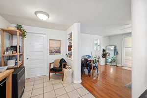 Interior space with wood counters, light wood finished floors, open shelves, and baseboards