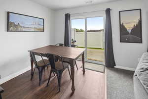 Dining area with baseboards and wood finished floors