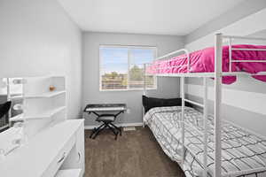 Carpeted bedroom with baseboards