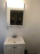 Unit B Bathroom featuring vanity
