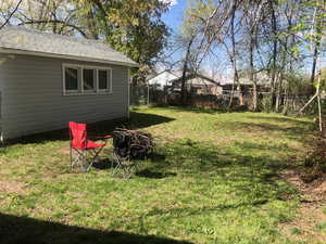 View of back yard with an outdoor structure