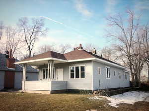Rear view of property with a porch