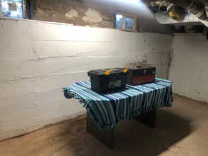Basement storage room 2 of unfinished concrete flooring