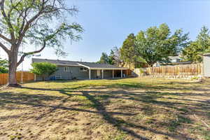 Rear view of house featuring a patio