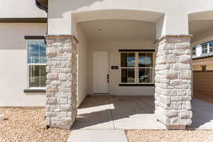 Property entrance with stucco siding