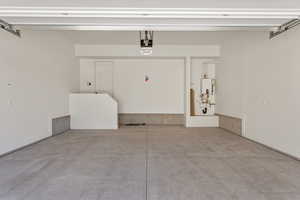 Garage with a garage door opener and water heater