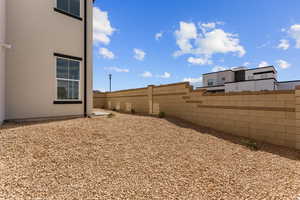 View of yard featuring fence