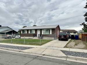 Ranch-style home with brick siding and driveway