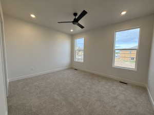 Unfurnished room with carpet, recessed lighting, baseboards, and ceiling fan