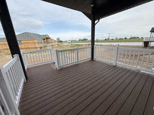 Wooden terrace featuring a water view