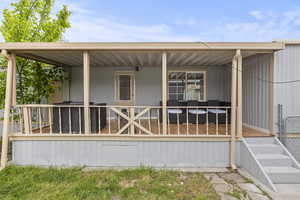 Back of house featuring a porch