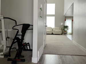 Hall with wood finished floors and baseboards