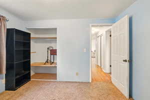 Unfurnished bedroom with carpet floors and a closet