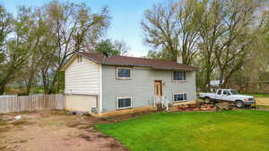 View of front of house featuring a chimney