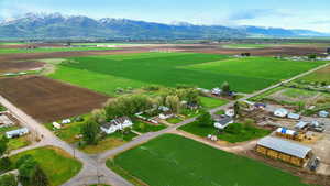 View of property location featuring rural landscape, mountains, and large plots for crops