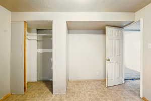Unfurnished bedroom featuring tile patterned flooring