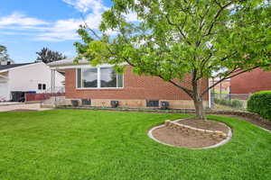 Rear view of house with brick siding