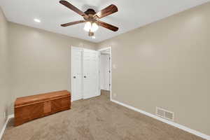 Unfurnished bedroom featuring carpet flooring, baseboards, recessed lighting, and ceiling fan