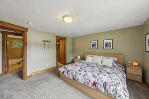 Bedroom with carpet and baseboards