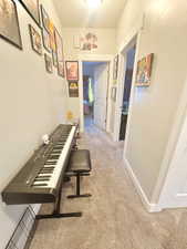 Hall featuring carpet floors