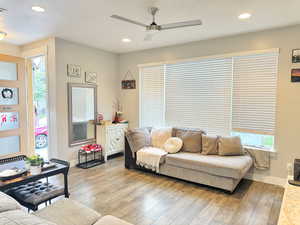 Living room featuring ceiling fan, hardwood / wood-style flooring, recessed lighting, and plenty of natural light