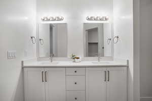 Bathroom featuring double vanity