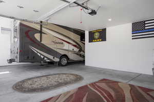 Garage with a garage door opener and recessed lighting