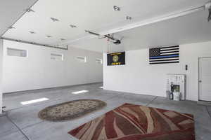 Garage featuring a garage door opener