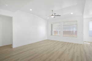 Unfurnished room featuring ceiling fan, light wood-style floors, baseboards, recessed lighting, and a smoke detector