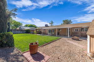 View of yard featuring an outdoor fire pit and a patio area