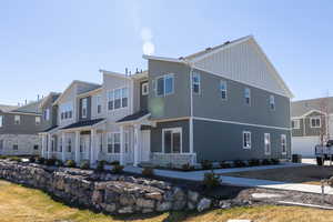 View of front of house with board and batten siding and a residential view