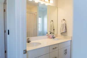 Bathroom featuring double vanity