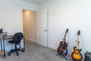 Office featuring carpet and baseboards