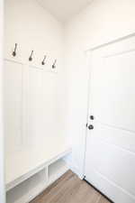 Mudroom featuring light wood-style floors