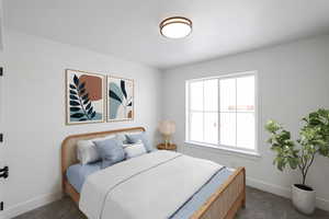 Bedroom with baseboards and carpet flooring