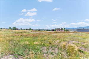 View of yard featuring a mountain view and a view of countryside