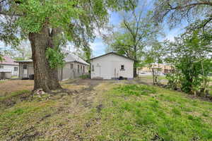 View of yard featuring fence
