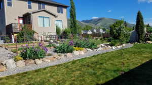 Rear of home, backyard. View of mountains