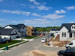 View of the neighborhood, valley, and lake from the front of the home.