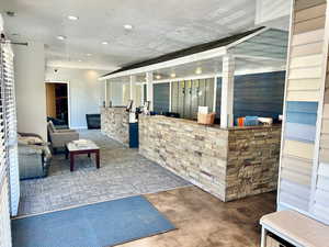 Reception featuring recessed lighting and a barn door