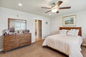 Bedroom with light carpet, recessed lighting, baseboards, and ceiling fan