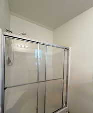 Full bath with a shower stall