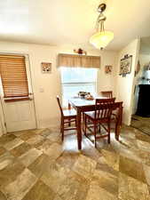 Dining room with stone finish floor
