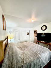 Bedroom featuring a textured ceiling