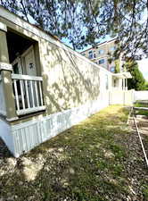 View of home's exterior with fence