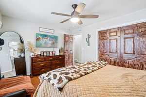 Bedroom with baseboards, ceiling fan, and a closet