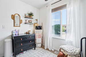 Sitting room featuring light colored carpet and baseboards