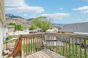 Wooden terrace with a mountain view and a residential view