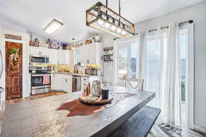 Dining area featuring light wood-style floors